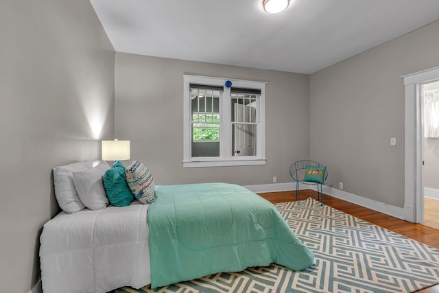 2642 Stuart St, Burns, TN 37029 - bedroom featuring baseboards and wood finished floors