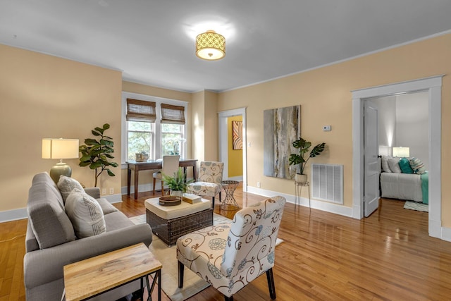 2642 Stuart St, Burns, TN 37029 - living room with wood finished floors, baseboards, and ornamental molding