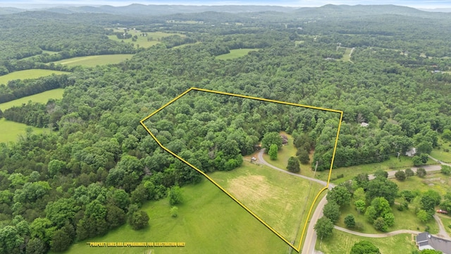 2101 Murray Kittrell Rd, Readyville, TN 37149 - aerial overview of property's location featuring a heavily wooded area, property boundaries highlighted, and a mountain backdrop