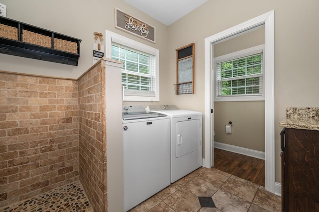 2101 Murray Kittrell Rd, Readyville, TN 37149 - laundry area with washing machine and clothes dryer, plenty of natural light, and baseboards