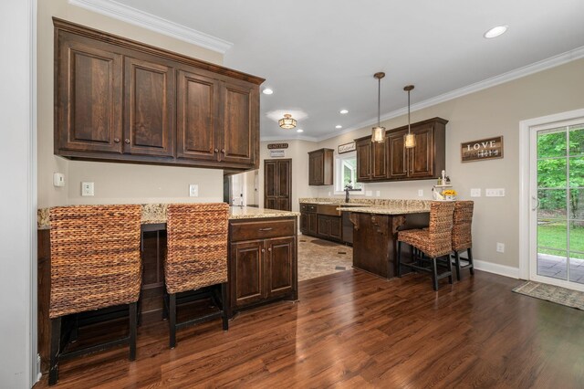 2101 Murray Kittrell Rd, Readyville, TN 37149 - kitchen featuring dark wood-style floors, dark brown cabinets, a peninsula, a kitchen bar, and ornamental molding
