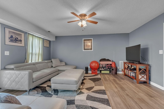 1383 Carters Creek Pike, Columbia, TN 38401 - living area featuring light wood-type flooring, ceiling fan, baseboards, and a textured ceiling
