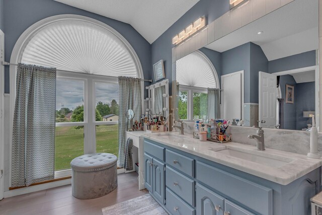1383 Carters Creek Pike, Columbia, TN 38401 - bathroom with lofted ceiling, double vanity, and wood finished floors