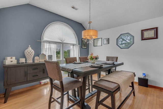 1383 Carters Creek Pike, Columbia, TN 38401 - dining room with lofted ceiling, a chandelier, light wood-type flooring, baseboards, and a textured ceiling