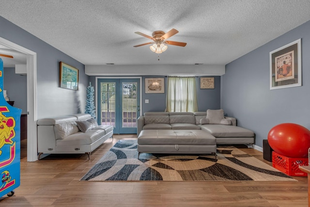1383 Carters Creek Pike, Columbia, TN 38401 - living area with wood finished floors, ceiling fan, and a textured ceiling