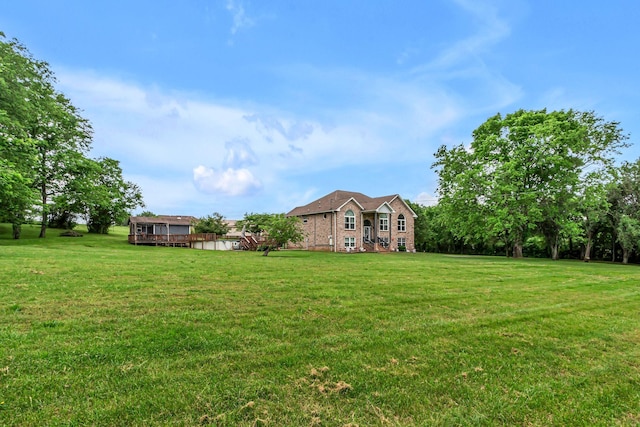 1383 Carters Creek Pike, Columbia, TN 38401 - view of green lawn featuring a wooden deck
