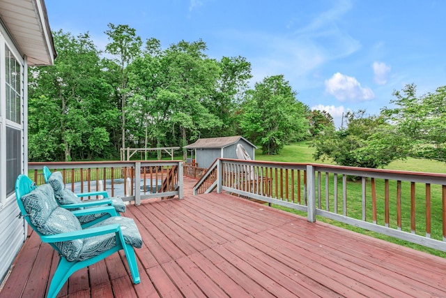 1383 Carters Creek Pike, Columbia, TN 38401 - wooden deck with a shed, an outdoor structure, a yard, and view of wooded area