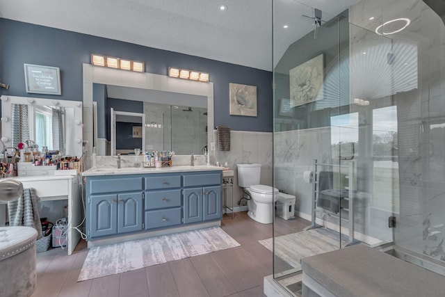 1383 Carters Creek Pike, Columbia, TN 38401 - full bath featuring a shower stall, toilet, double vanity, wood finished floors, and tile walls