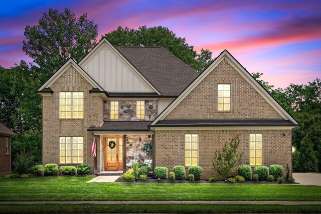 2477 Settlers Trce, Clarksville, TN 37043 - view of front of house with a lawn, board and batten siding, and brick siding