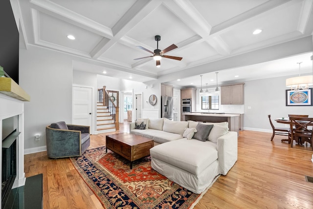 2477 Settlers Trce, Clarksville, TN 37043 - living room featuring healthy amount of natural light, a fireplace with flush hearth, light wood finished floors, ceiling fan, and coffered ceiling