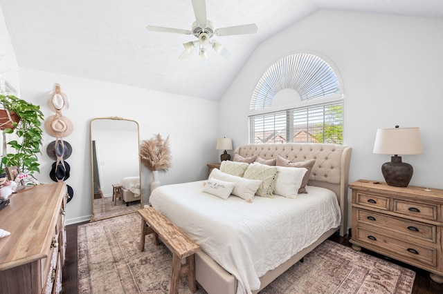 bedroom with lofted ceiling, wood finished floors, and a ceiling fan