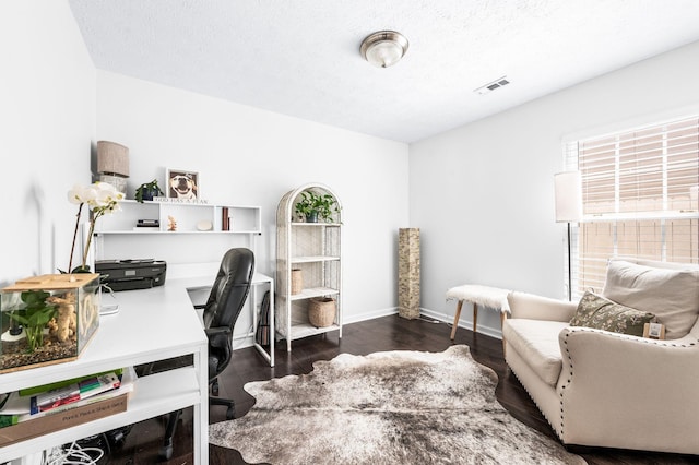 office space with wood finished floors, baseboards, and a textured ceiling