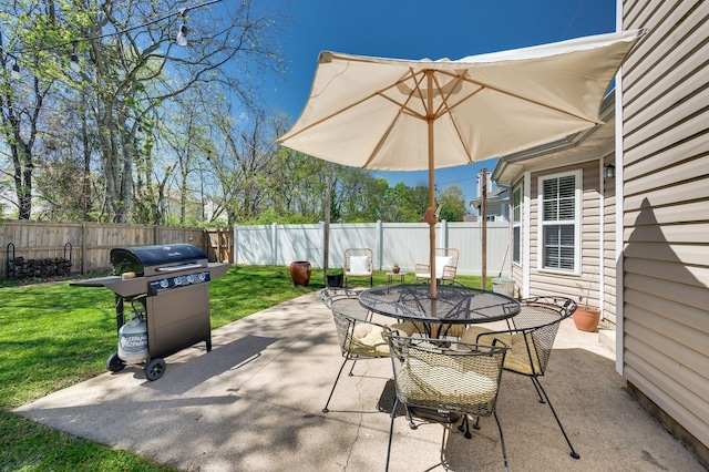 view of patio / terrace with outdoor dining space and a grill