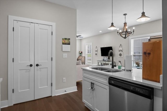 11 Sycamore Rdg W, Burns, TN 37029 - kitchen with dishwasher, a sink, dark wood-type flooring, baseboards, and light stone counters