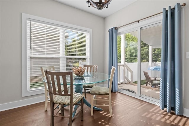 11 Sycamore Rdg W, Burns, TN 37029 - dining area with wood finished floors, baseboards, and a chandelier