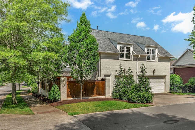 622 Stonewater Blvd, Franklin, TN 37064 - view of front of property with concrete driveway, brick siding, an attached garage, and a shingled roof