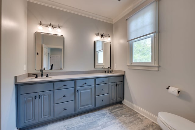 622 Stonewater Blvd, Franklin, TN 37064 - bathroom with baseboards, double vanity, ornamental molding, and toilet