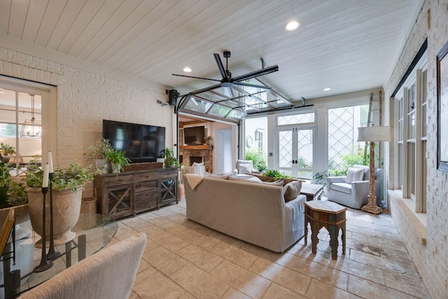 622 Stonewater Blvd, Franklin, TN 37064 - living area with healthy amount of natural light, wooden ceiling, brick wall, a fireplace, and recessed lighting