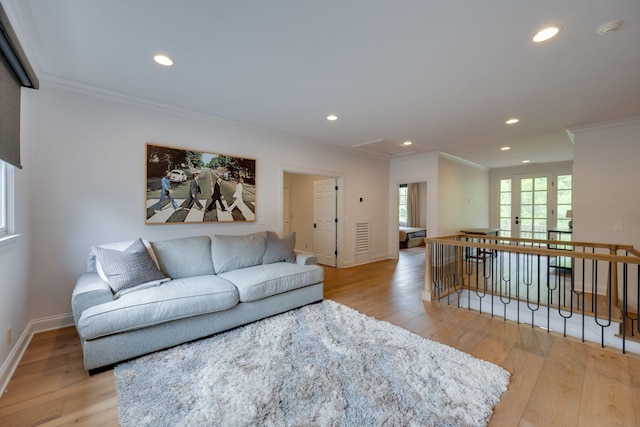 622 Stonewater Blvd, Franklin, TN 37064 - living room with ornamental molding, light wood finished floors, recessed lighting, attic access, and baseboards