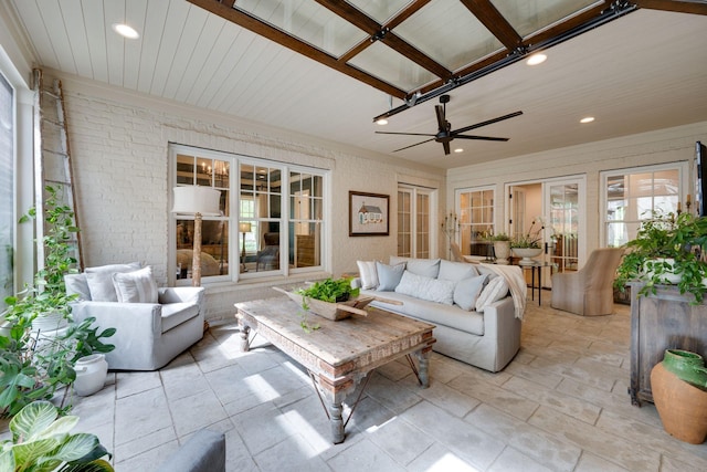 622 Stonewater Blvd, Franklin, TN 37064 - living area with brick wall, recessed lighting, and crown molding