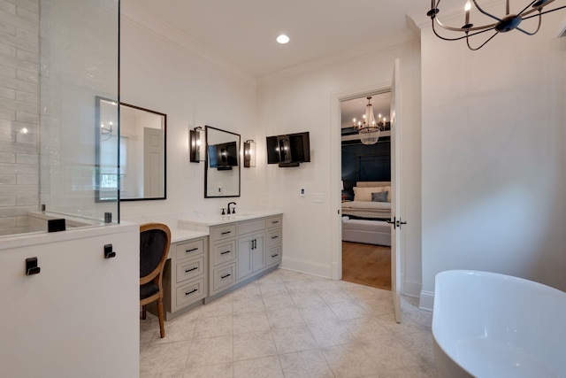 622 Stonewater Blvd, Franklin, TN 37064 - bathroom featuring a chandelier, a freestanding tub, double vanity, crown molding, and baseboards