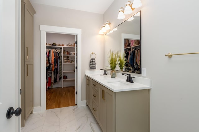 4345 S Garrett Rd, Springfield, TN 37172 - bathroom featuring double vanity, a spacious closet, marble finish floors, and baseboards