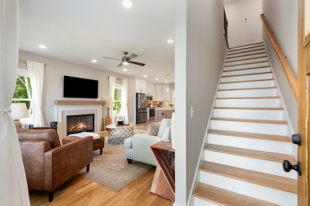 4345 S Garrett Rd, Springfield, TN 37172 - staircase featuring healthy amount of natural light, a ceiling fan, recessed lighting, a tile fireplace, and wood finished floors
