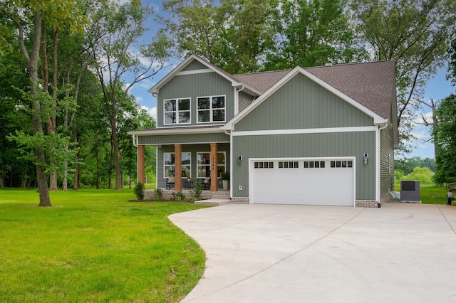 4345 S Garrett Rd, Springfield, TN 37172 - craftsman inspired home with a porch, a front lawn, driveway, a garage, and roof with shingles