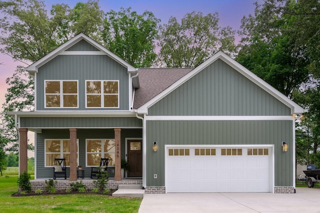 4345 S Garrett Rd, Springfield, TN 37172 - view of front facade featuring a porch, an attached garage, driveway, and roof with shingles