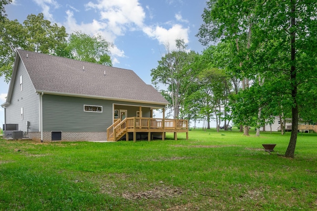 4345 S Garrett Rd, Springfield, TN 37172 - rear view of house with a wooden deck, a yard, and roof with shingles