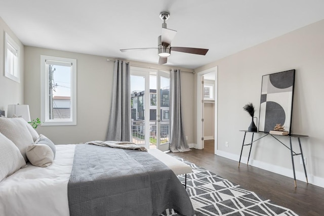 bedroom with wood finished floors, baseboards, and a ceiling fan