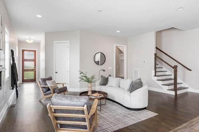 living area featuring stairs, dark wood-style flooring, baseboards, and recessed lighting