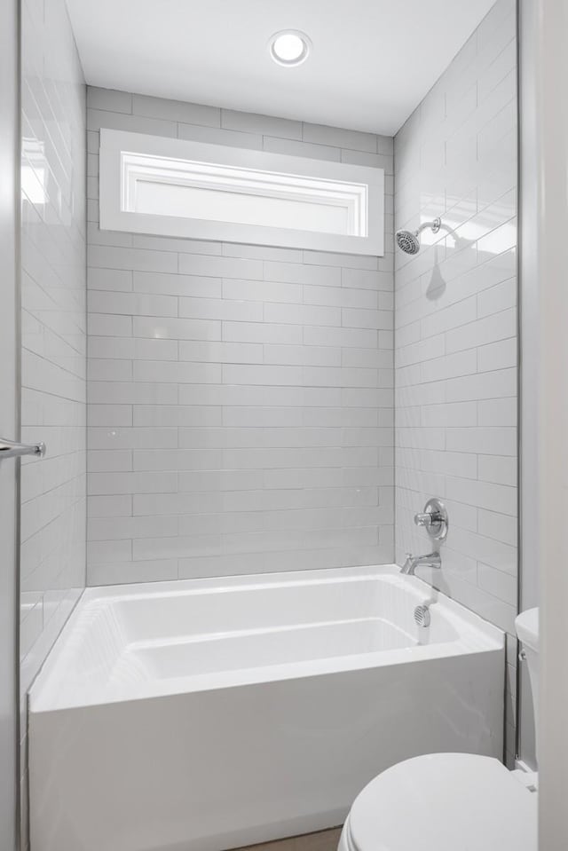 full bathroom featuring toilet and shower / bath combination