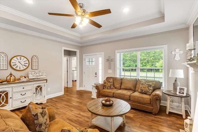 401 Hancock Ln, Tullahoma, TN 37388 - living area with wood finished floors, ceiling fan, baseboards, crown molding, and a tray ceiling