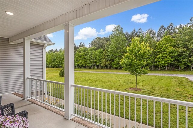401 Hancock Ln, Tullahoma, TN 37388 - covered porch featuring a yard and view of scattered trees