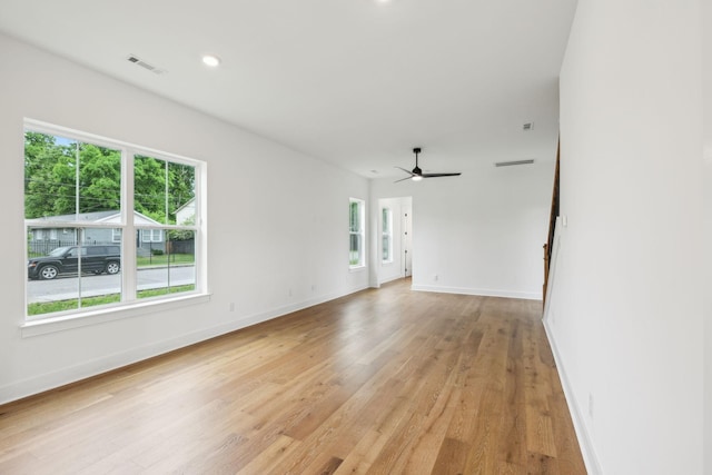 unfurnished room with light wood-style flooring, a ceiling fan, baseboards, and recessed lighting