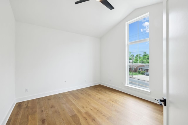 bonus room with wood finished floors, ceiling fan, vaulted ceiling, and baseboards