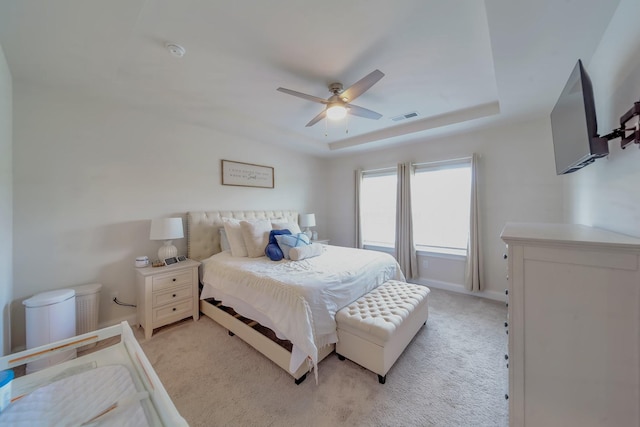 4022 Arrowleaf Ln, Antioch, TN 37013 - bedroom with light colored carpet, baseboards, a ceiling fan, and a raised ceiling