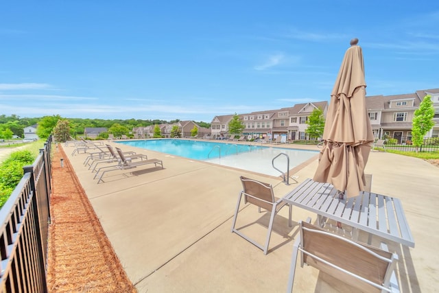 4022 Arrowleaf Ln, Antioch, TN 37013 - community pool with fence, a patio, and a residential view
