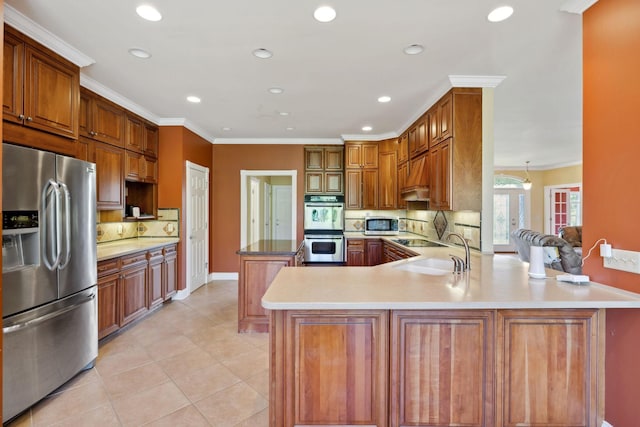 219 Dale Ln, Hilham, TN 38568 - kitchen featuring appliances with stainless steel finishes, a peninsula, crown molding, recessed lighting, and a sink