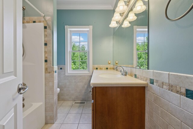 219 Dale Ln, Hilham, TN 38568 - full bathroom with tile walls, tile patterned flooring, crown molding, vanity, and a chandelier