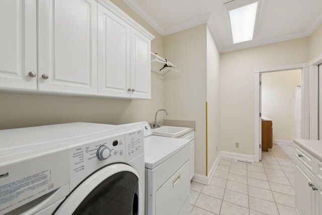 219 Dale Ln, Hilham, TN 38568 - laundry area with washer and dryer, cabinet space, light tile patterned floors, ornamental molding, and baseboards