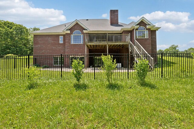 219 Dale Ln, Hilham, TN 38568 - rear view of house with brick siding, a chimney, and stairway