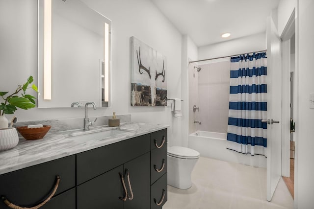 full bath featuring vanity, toilet, and shower / tub combo