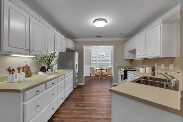 3319 Mershon Dr, Murfreesboro, TN 37128 - kitchen with a sink, stainless steel appliances, dark wood-type flooring, white cabinetry, and crown molding