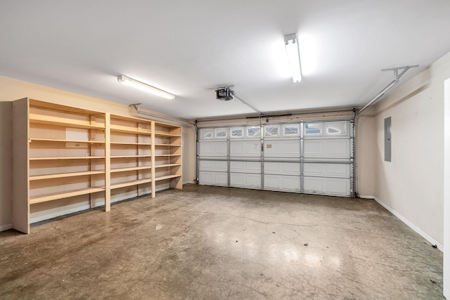 3319 Mershon Dr, Murfreesboro, TN 37128 - garage featuring electric panel, baseboards, and a garage door opener