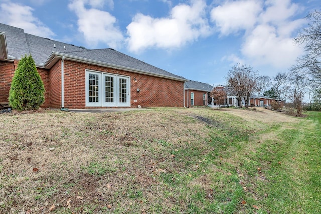 3319 Mershon Dr, Murfreesboro, TN 37128 - rear view of property with brick siding, a yard, and a shingled roof
