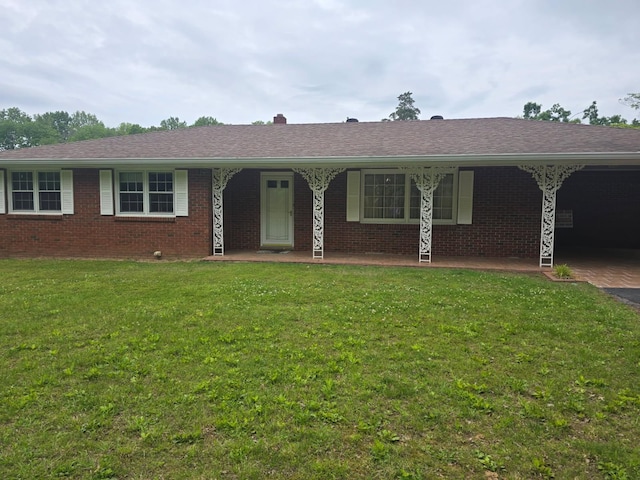 single story home featuring a front lawn, brick siding, and covered porch