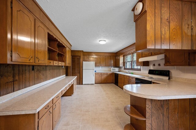 915 Taylor Cir, Burns, TN 37029 - kitchen featuring open shelves, white appliances, under cabinet range hood, light countertops, and a textured ceiling