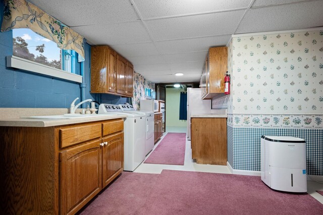 915 Taylor Cir, Burns, TN 37029 - kitchen featuring wallpapered walls, a sink, light countertops, separate washer and dryer, and a drop ceiling